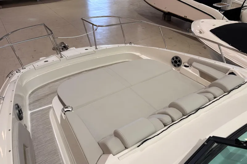Slide: The Image of 2027 Sea Ray Sundancer 320 boat interior with spacious seating and sleek design. - 17