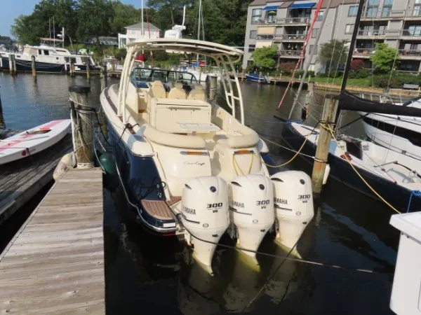 Slide: The Image of A 2016 Chris-Craft 36 Launch docked, featuring three Yamaha outboard engines. - 4