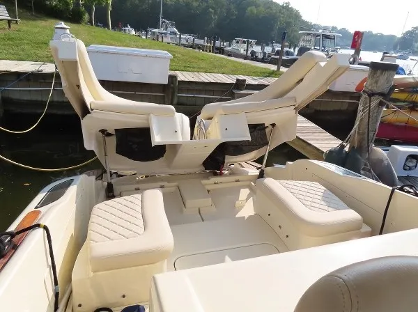 Slide: The Image of The image shows the cockpit of a 2016 Chris-Craft 36 Launch with luxurious seating. - 20