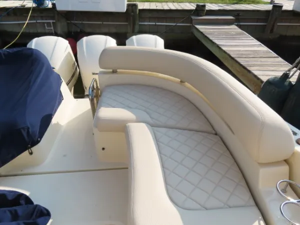 Slide: The Image of The 2016 Chris-Craft 36 Launch features elegant cream upholstery with a quilted pattern. - 17