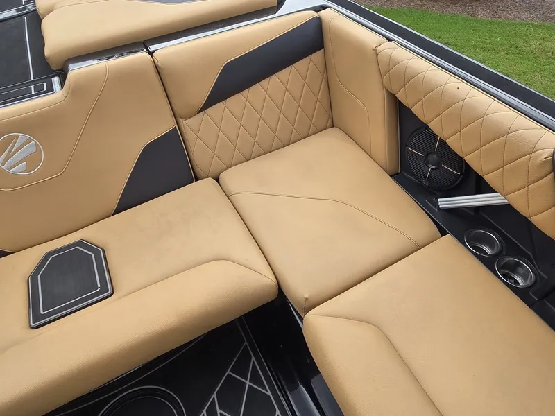 Slide: The Image of The 2022 Tigé Z3 features luxurious beige upholstery with black accents and a built-in speaker. - 16