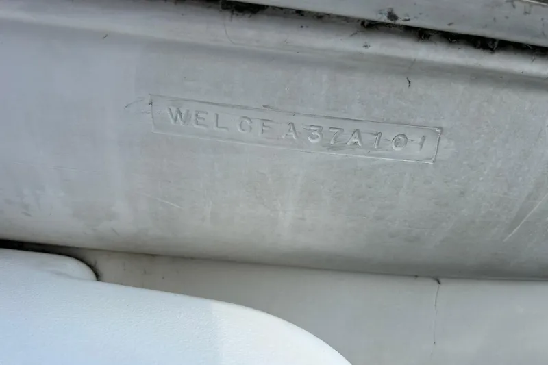 Slide: The Image of 2001 Wellcraft 3700 Martinique hull identification number on boat exterior. - 35