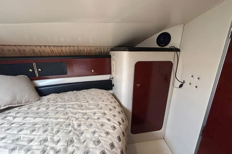 Slide: The Image of Interior cabin of 2001 Wellcraft 3700 Martinique with bed and storage cabinets. - 26