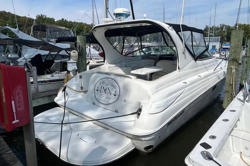 Slide: The Image of 2001 Wellcraft 3700 Martinique yacht docked at marina, rear view. - 1