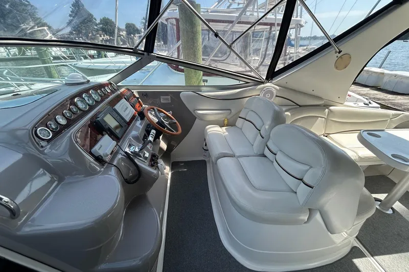 Slide: The Image of 2001 Wellcraft 3700 Martinique boat interior with helm, seating, and dashboard controls. - 14
