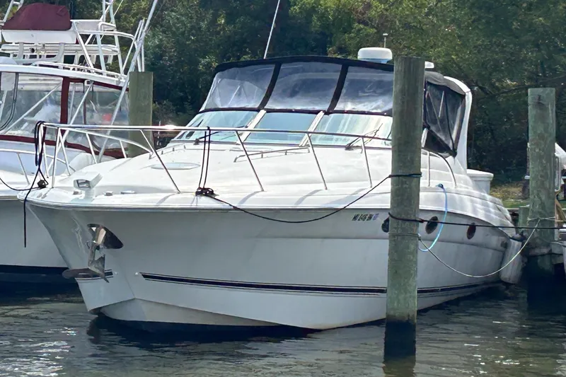 Slide: The Image of 2001 Wellcraft 3700 Martinique yacht docked at marina, front view. - 4