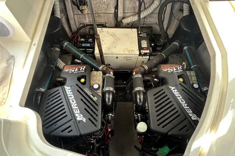 Slide: The Image of Engine compartment of a 2001 Wellcraft 3700 Martinique with dual Mercury engines. - 30