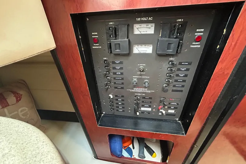 Slide: The Image of Electrical panel of a 2001 Wellcraft 3700 Martinique boat, featuring various switches and controls. - 29