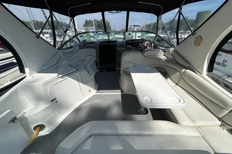 Slide: The Image of 2001 Wellcraft 3700 Martinique boat interior with seating and table, docked at marina. - 10
