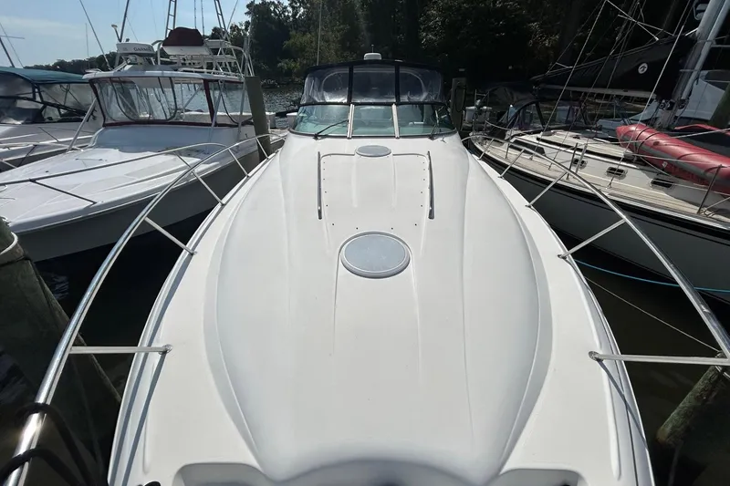 Slide: The Image of 2001 Wellcraft 3700 Martinique boat docked among other vessels in a marina. - 8