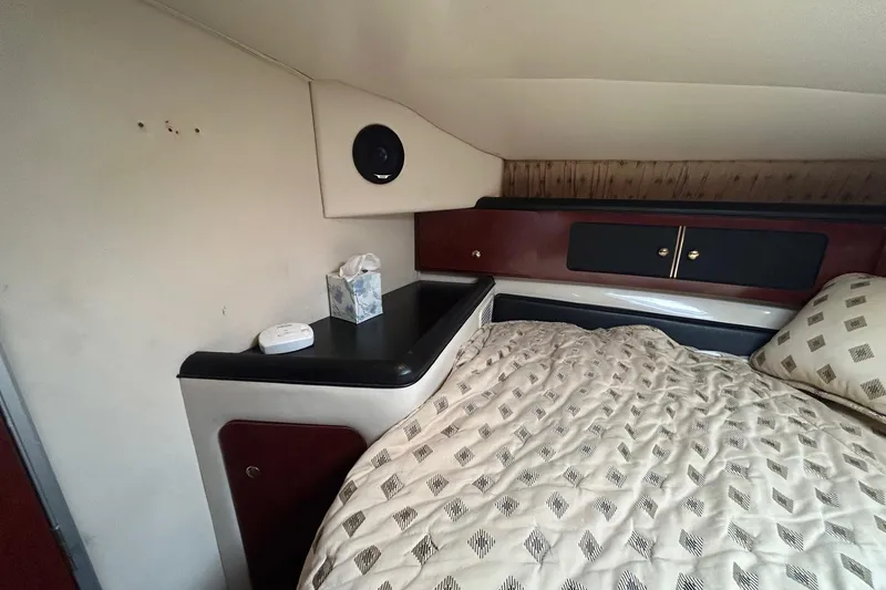 Slide: The Image of Interior cabin of 2001 Wellcraft 3700 Martinique with bed and storage cabinets. - 25
