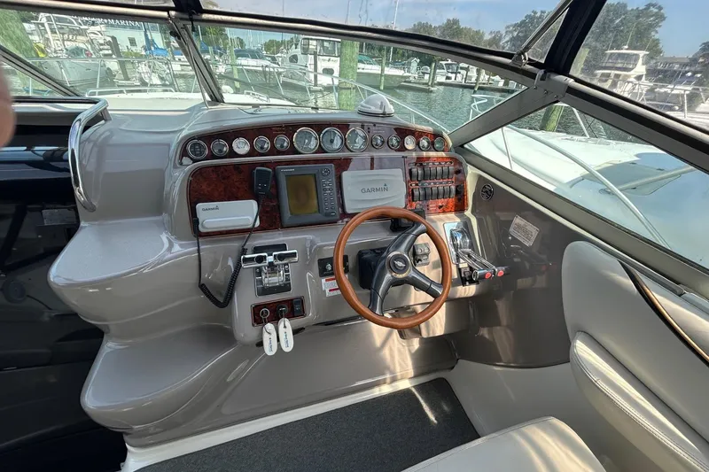 Slide: The Image of Cockpit of 2001 Wellcraft 3700 Martinique with steering wheel and navigation instruments. - 16