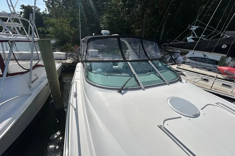 Slide: The Image of 2001 Wellcraft 3700 Martinique docked among other boats in a marina. - 9