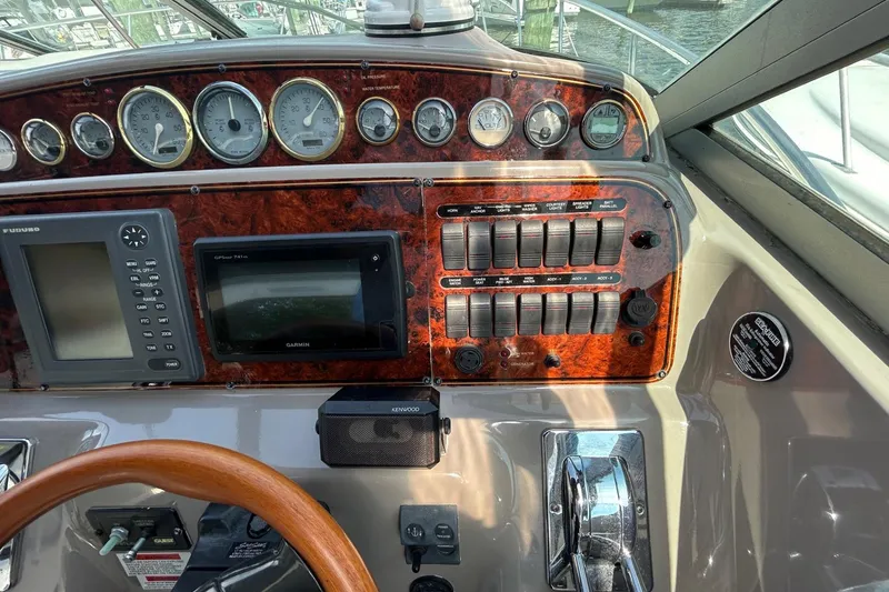 Slide: The Image of 2001 Wellcraft 3700 Martinique dashboard with gauges, controls, and navigation systems. - 17
