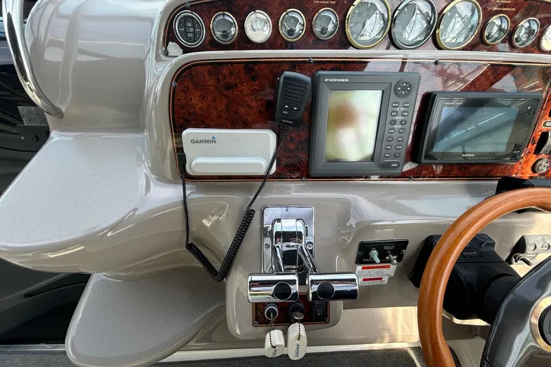 Slide: The Image of Control panel of a 2001 Wellcraft 3700 Martinique boat with navigation equipment. - 18