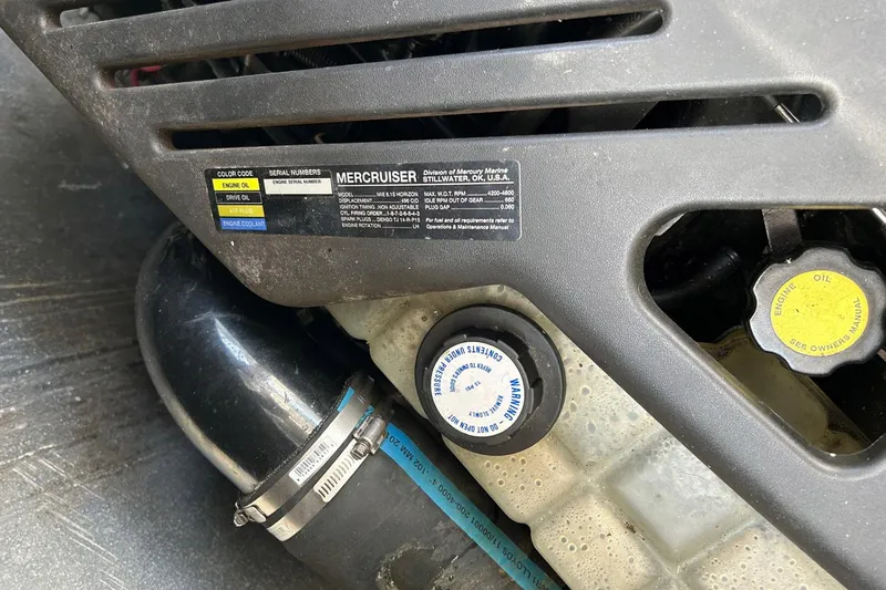 Slide: The Image of Engine compartment of 2001 Wellcraft 3700 Martinique with MerCruiser label and oil cap. - 34