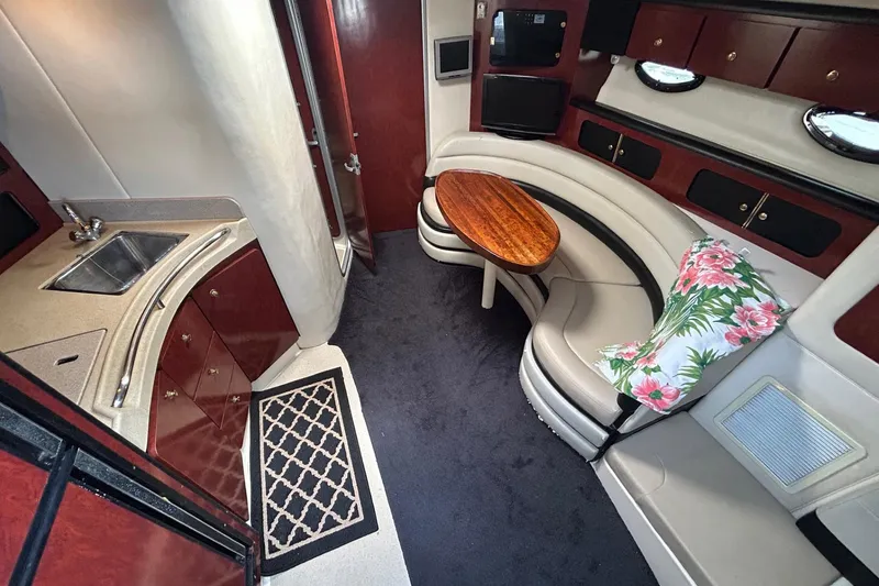 Slide: The Image of Interior of 2001 Wellcraft 3700 Martinique yacht with kitchen and seating area. - 20