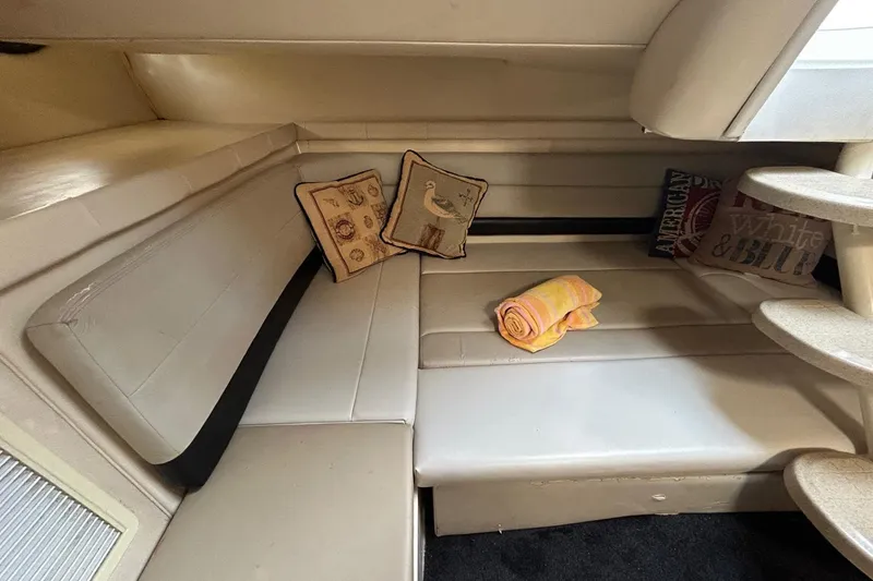 Slide: The Image of 2001 Wellcraft 3700 Martinique cabin interior with cushions and rolled towel. - 23
