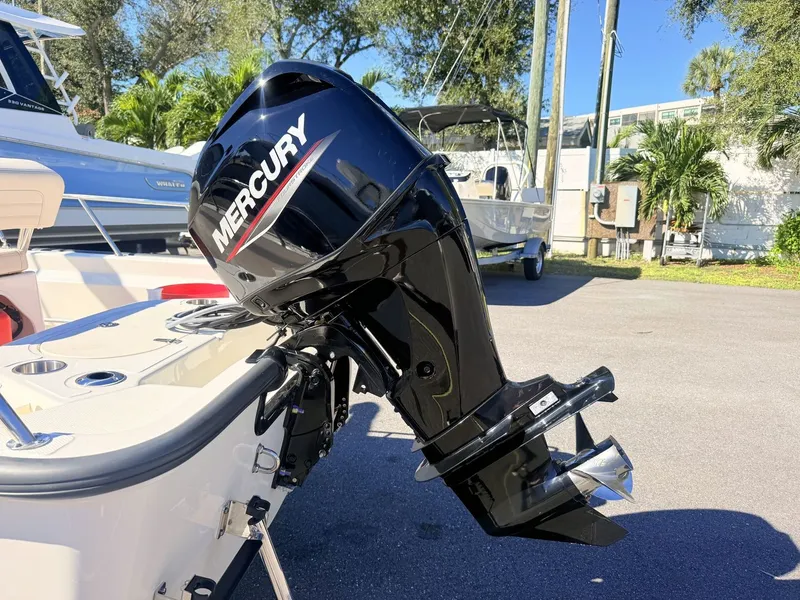 Slide: The Image of A Mercury outboard motor is mounted on a Boston Whaler 150 Montauk boat. - 14