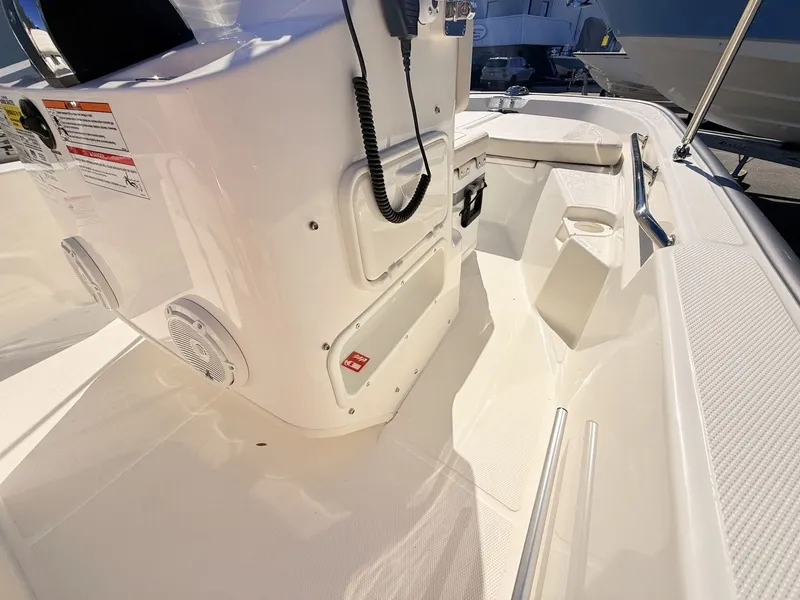 Slide: The Image of The image shows the cockpit of a 2027 Boston Whaler 150 Montauk with white interior. - 27