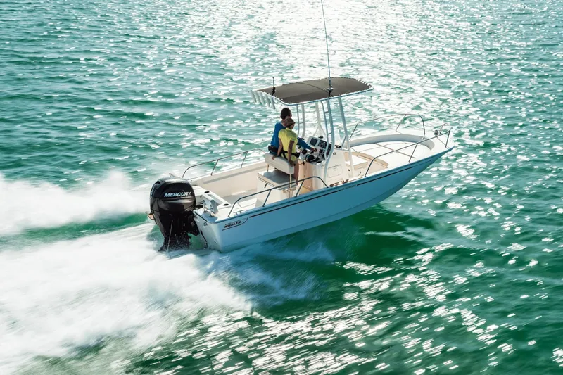 Slide: The Image of A 2027 Boston Whaler 190 Montauk speeds across sparkling water. - 15