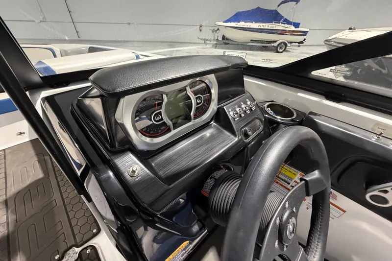 Slide: The Image of Dashboard of a 2022 Scarab 195 ID boat with steering wheel and gauges. - 9