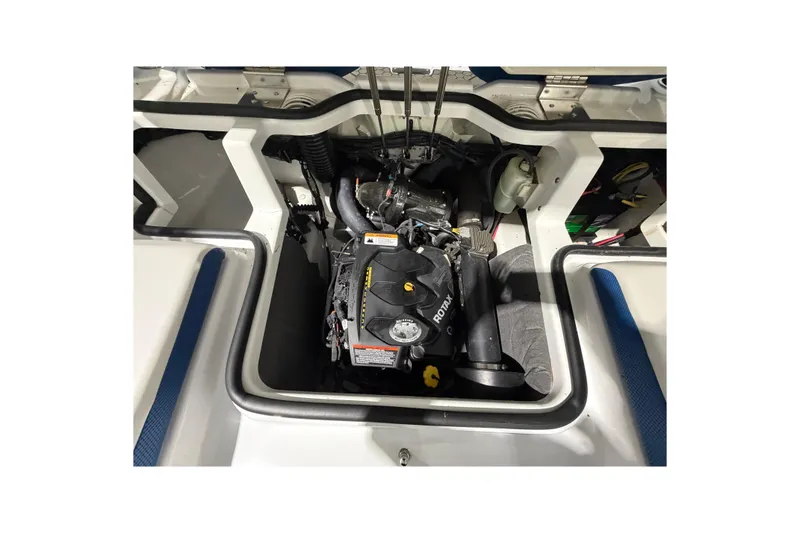 Slide: The Image of Engine compartment of a 2022 Scarab 195 ID boat, featuring a Rotax engine. - 15