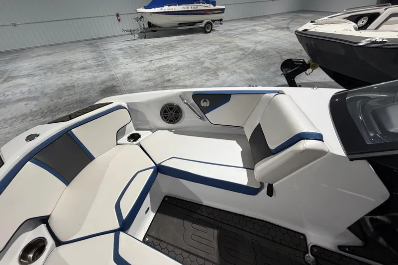 Slide: The Image of Interior of a 2022 Scarab 195 ID boat with stylish seating and cup holders. - 6