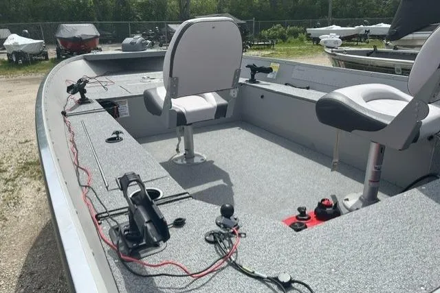 Slide: The Image of 2022 Smoker Craft Angler 14 T fishing boat interior with seating and equipment. - 3