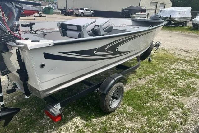 Slide: The Image of 2022 Smoker Craft Angler 14 T boat on trailer, parked outdoors. - 10