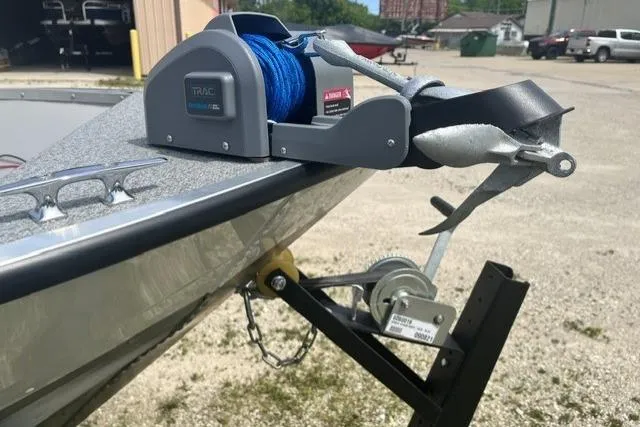 Slide: The Image of 2022 Smoker Craft Angler 14 T boat with anchor winch and trailer in a parking lot. - 2