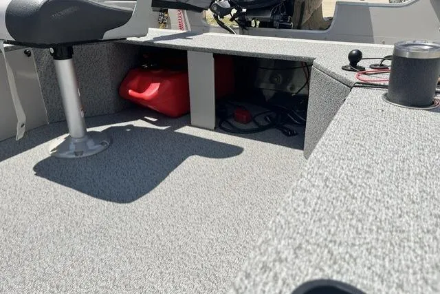 Slide: The Image of 2022 Smoker Craft Angler 14 T boat interior with storage compartment and seating. - 8