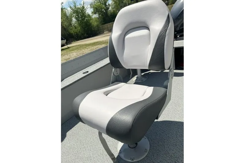 Slide: The Image of 2022 Smoker Craft Angler 14 T boat seat, gray and white, outdoor setting. - 11