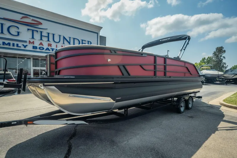 Slide: The Image of 2026 Evotti 525QL pontoon boat on trailer at Big Thunder Marine dealership. - 4