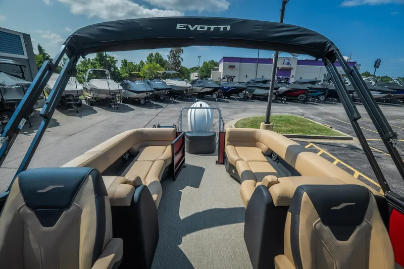 Slide: The Image of 2026 Evotti 525QL luxury boat interior with tan seating, parked in a marina. - 31
