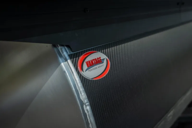 Slide: The Image of Close-up of 2026 Evotti 525QL with Vantage Pontoon Wraps logo. - 8
