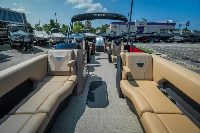 Slide: The Image of 2026 Evotti 525QL luxury boat interior with tan seating, displayed outdoors under a clear blue sky. - 17