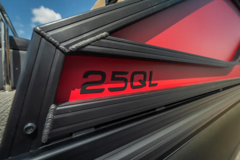 Slide: The Image of Close-up of 2026 Evotti 525QL boat model with red and black detailing. - 16