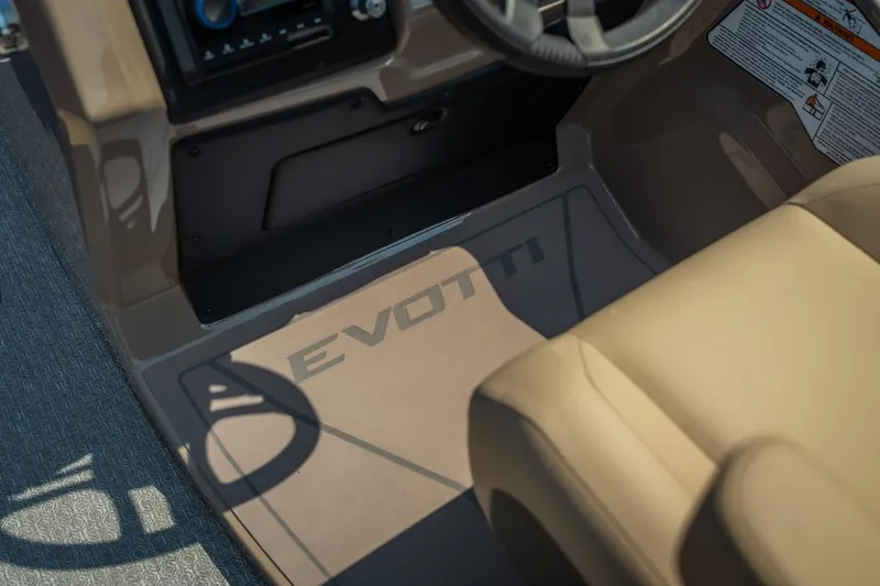 Slide: The Image of Interior of 2026 Evotti 525QL boat, featuring steering wheel and branded flooring. - 30
