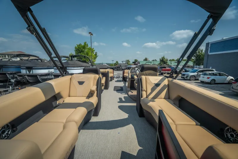 Slide: The Image of 2026 Evotti 525QL pontoon boat with luxurious seating, displayed outdoors under a clear sky. - 37