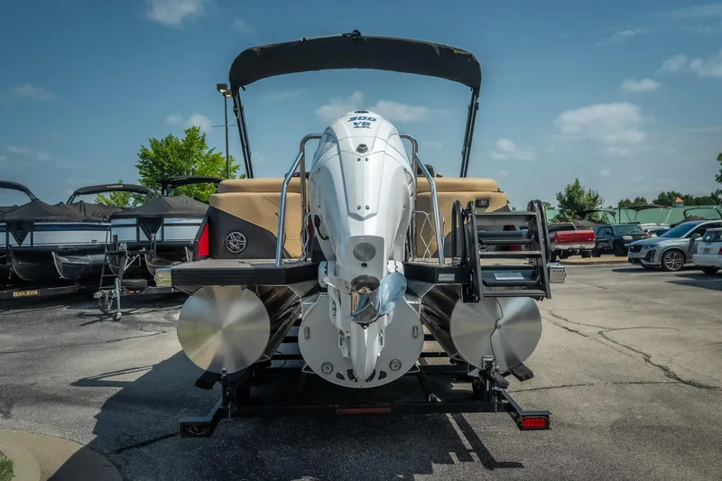 Slide: The Image of 2026 Evotti 525QL pontoon boat with powerful outboard motor in a parking lot. - 11