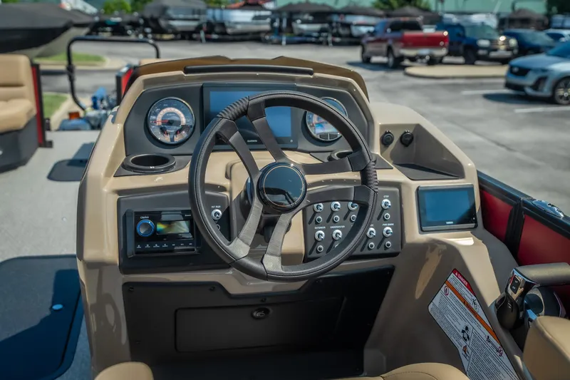 Slide: The Image of Steering console of 2026 Evotti 525QL boat with modern controls and dashboard. - 25