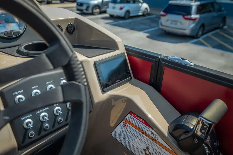 Slide: The Image of Interior dashboard of 2026 Evotti 525QL boat with control panel and steering wheel. - 27