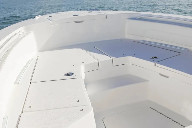 Slide: The Image of Manufacturer Provided Image: 2026 Regulator 24XO boat deck with seating, overlooking calm ocean waters. - 7