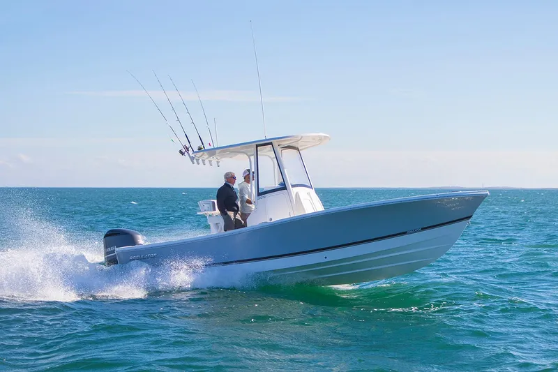 Slide: The Image of Manufacturer Provided Image: Regulator 24XO 2026 boat on the sea, two people onboard. - 1
