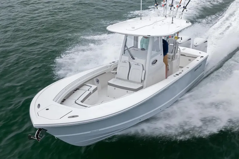 Slide: The Image of Manufacturer Provided Image: 2026 Regulator 28 boat cruising on open water, showcasing sleek design and performance. - 1