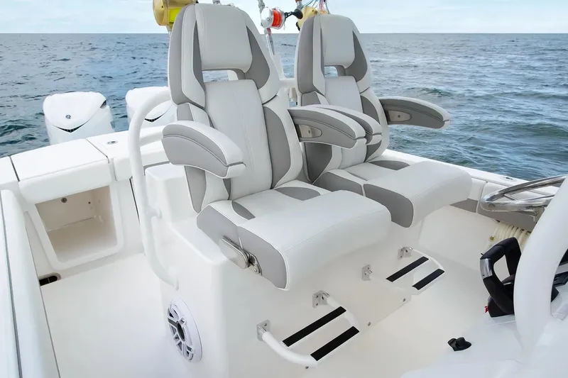 Slide: The Image of Manufacturer Provided Image: Luxury seating on 2026 Regulator 28 boat, featuring ergonomic design and ocean backdrop. - 6