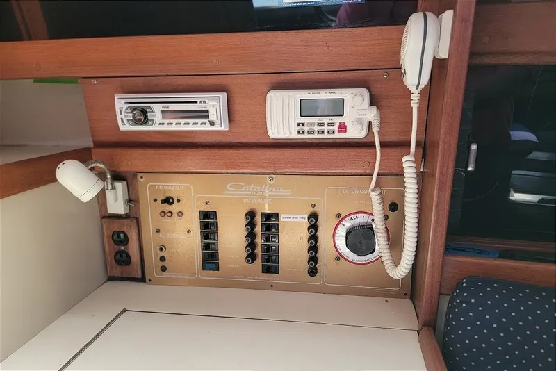 Slide: The Image of Control panel of a 1986 Catalina 34 sailboat with radio and electrical switches. - 7