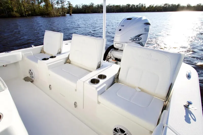 Slide: The Image of Manufacturer Provided Image: 2026 Regulator 26XO boat interior with Yamaha XTO engine, featuring comfortable seating and cup holders. - 10