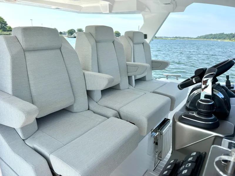 Slide: The Image of The image shows the cockpit of a 2019 Azimut Verve 40 with gray seats and a modern helm. - 15